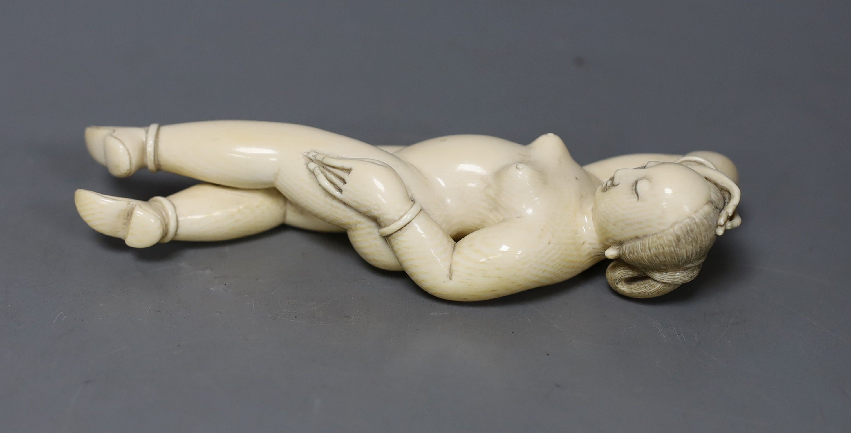 A 19th century Chinese carved ivory medicine doll, 15cm